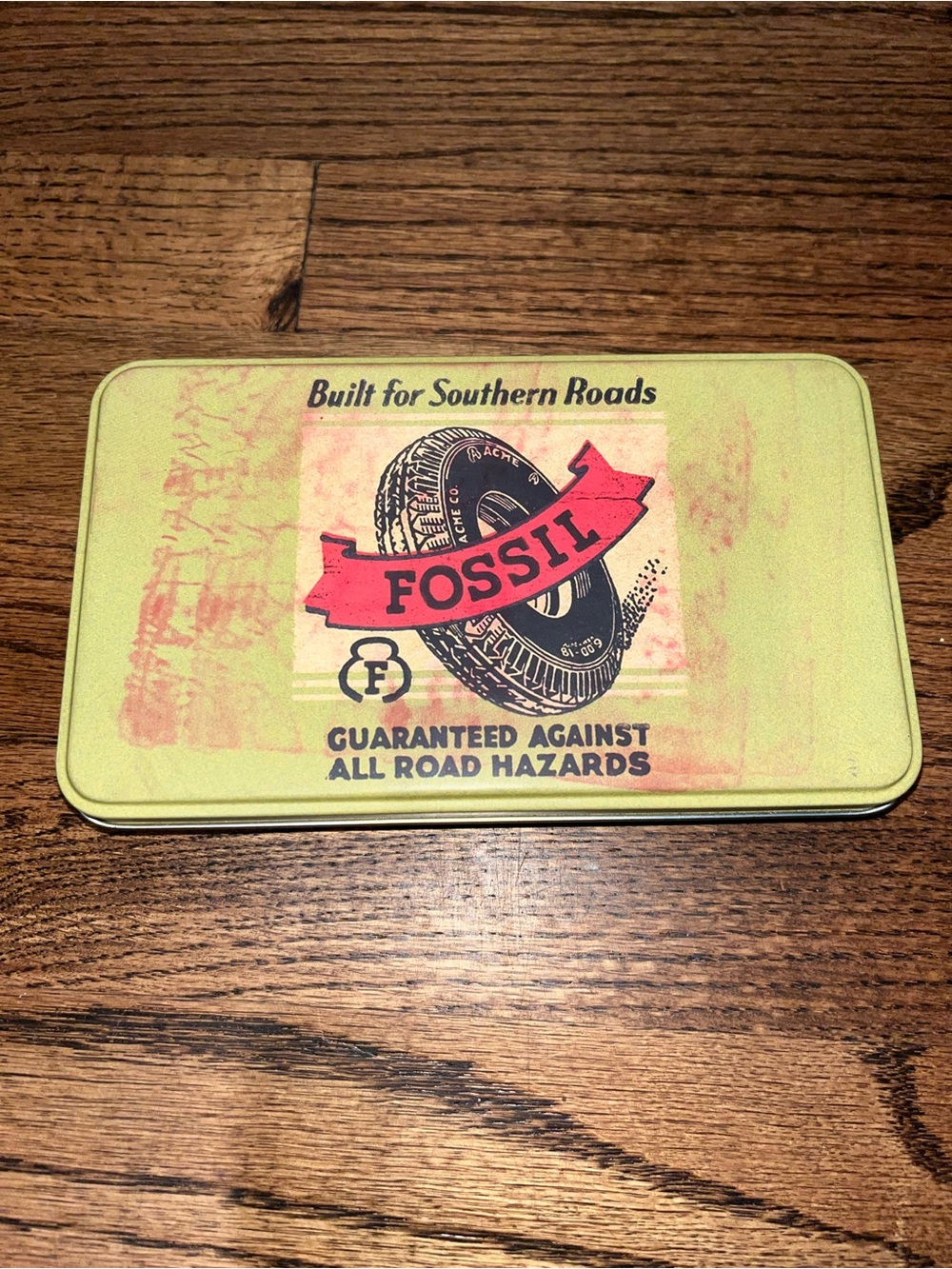 Fossil Tin box Green with Red Tire Banner Graphic